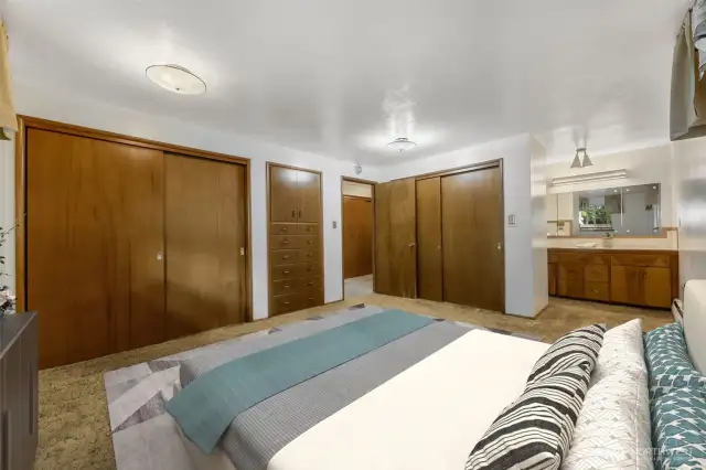 Primary bedroom features double closets and built ins. Virtually staged.