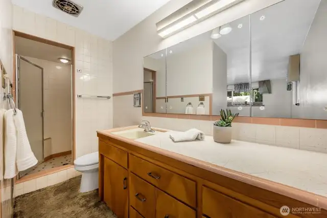 Three quarter bathroom off primary bedroom.