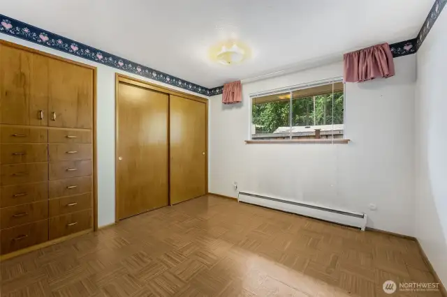 Bedroom 2-features closet with sliding doors and wood built ins.