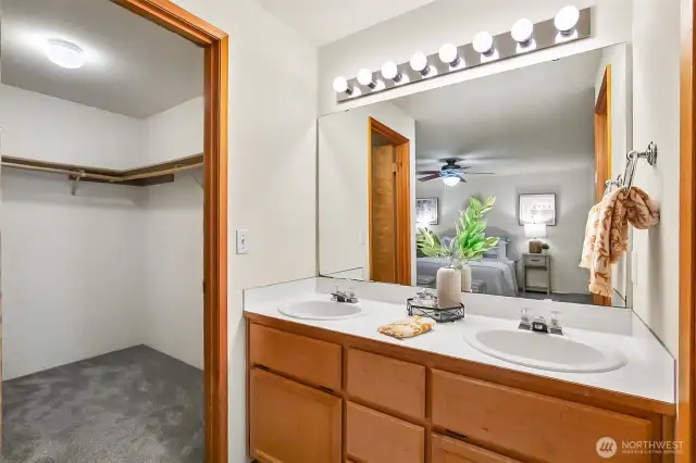 Primary double sink vanity and walk-in closet