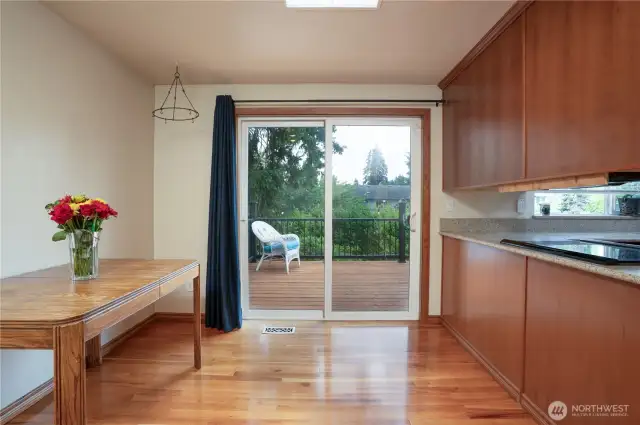 Eating area off kitchen with slider to deck