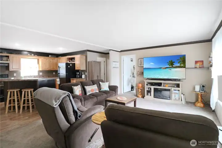Wide open and full of light make this living, kitchen, and dining space perfect for gathering with family and friends.