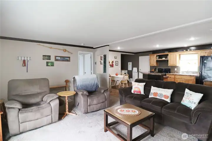Open concept living room with great natural light, seamlessly connected to the kitchen and dining area—perfect for gatherings.