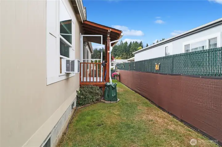 Covered front porch offers a welcoming entry, while the privacy fence provides seclusion for your outdoor space.