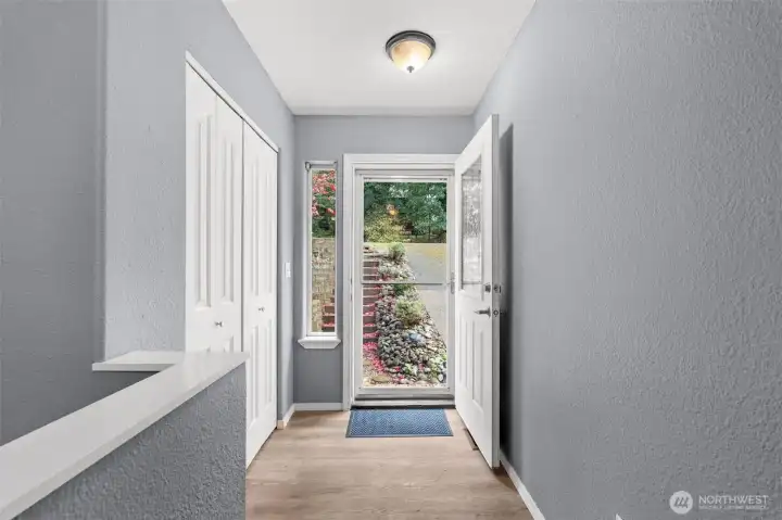 Long entry with closet at front door.