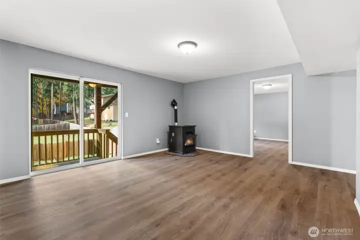 Exit to lower patio.  Pellet stove warms the whole downstairs.