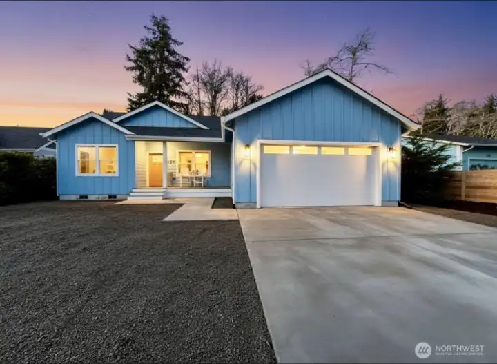 New Ocean Shores home across from Bay front is ready for you to start your beach living! picture is enhanced.