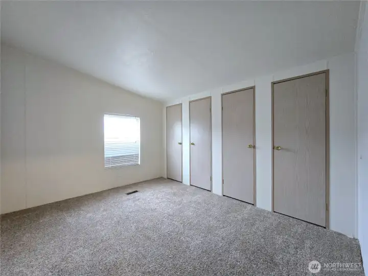 Versatile secondary bedroom with ample closet space—perfect for guests, a home office, or hobby room.