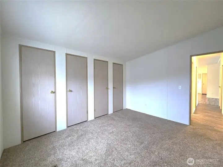 Wall of closets providing abundant storage with room to personalize.