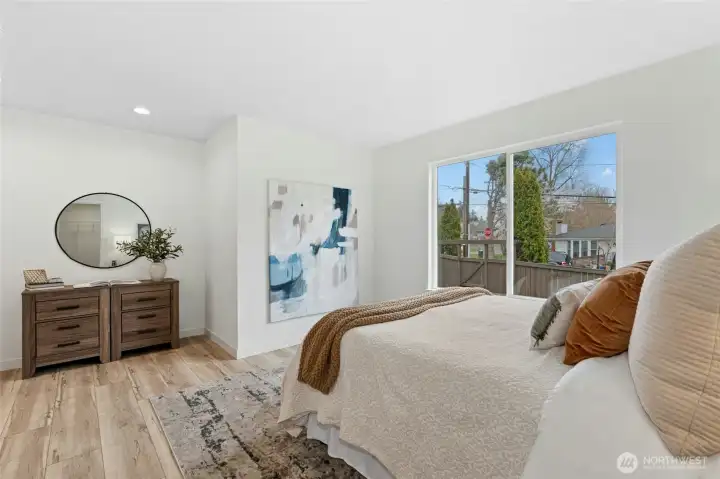 Main level bedroom with attached bathroom