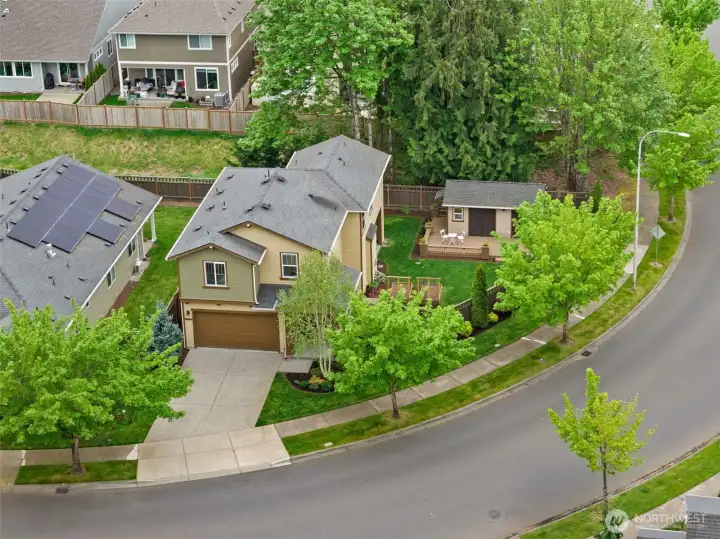 Welcome home, tucked on one of the larger corner lots in the community with a fully finished custom shop