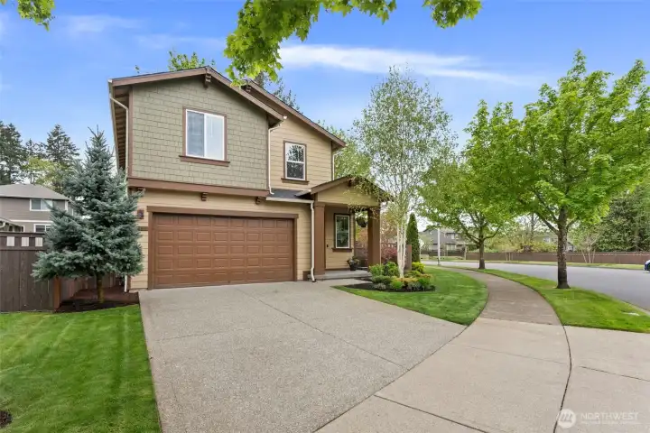 Thoughtfully landscaped front yard with built-in irrigation for easy maintenance
