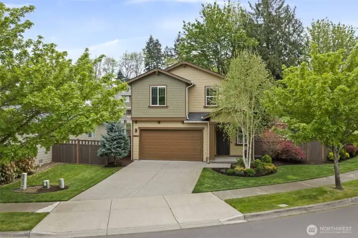 Thoughtfully landscaped front yard with built-in irrigation for easy maintenance
