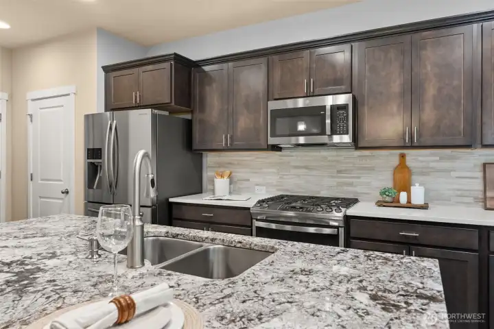 Kitchen is also equipped with pantry storage