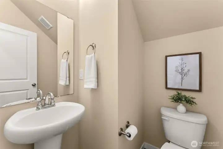 Powder room conveniently located off the kitchen