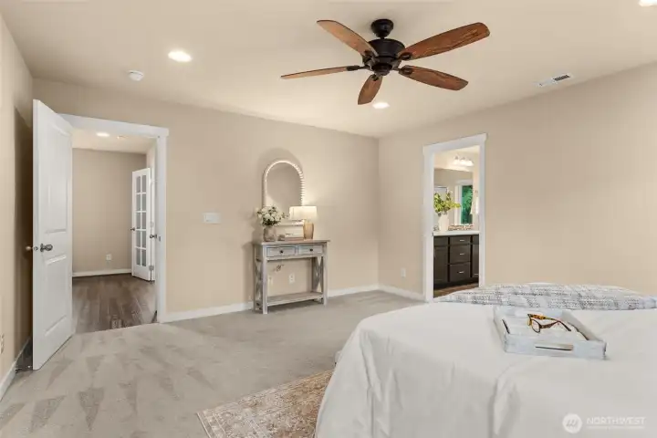 Primary bedroom with plush carpet for added comfort
