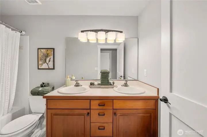 full bath off the hallway shared doucle vanity sinks