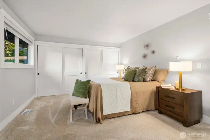 another view of the bedroom wall of closets with organizers