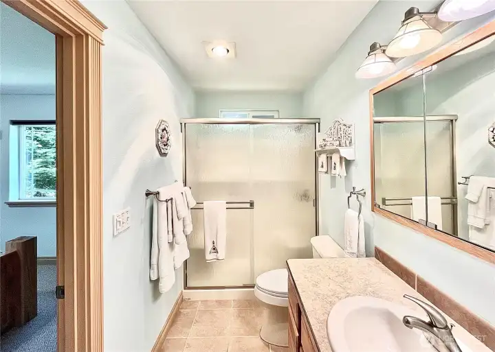 Bright and Clean Primary Suite Bathroom,   Painted in Beautiful Coastal Hues. The   Serene Color Palette Creates a Calm,   Relaxing Atmosphere
