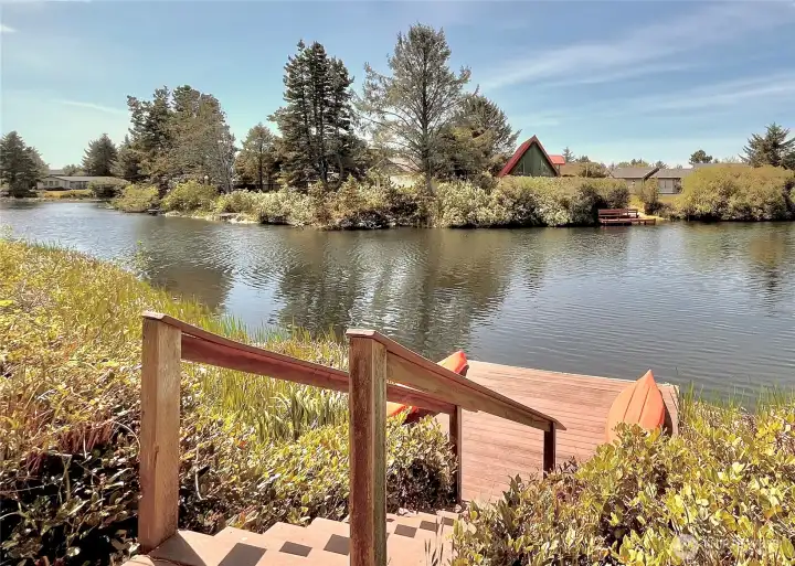 Just steps from your outdoor living space, a   sturdy staircase leads to your private dock,   offering direct access to the serene waters of   the Bell Canal. With 37 feet of pristine   shoreline, this property provides ample   space for water activities, whether it's   launching a kayak, fishing off the dock, or   simply soaking in the tranquil surroundings.