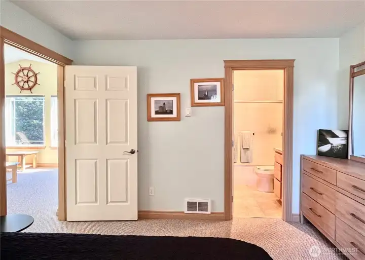 Cozy upstairs bedroom offers a private   retreat with convenient access to the full   bathroom and spacious walk-in closet.