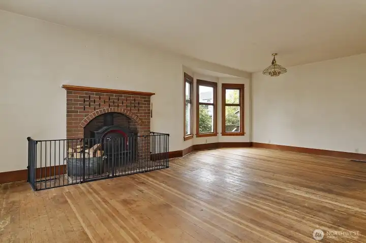 A wood fireplace insert in the spacious living room keeps it cozy!