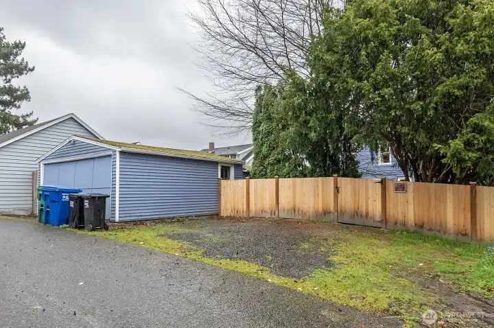 From the alley showing detached garage and off street parking.