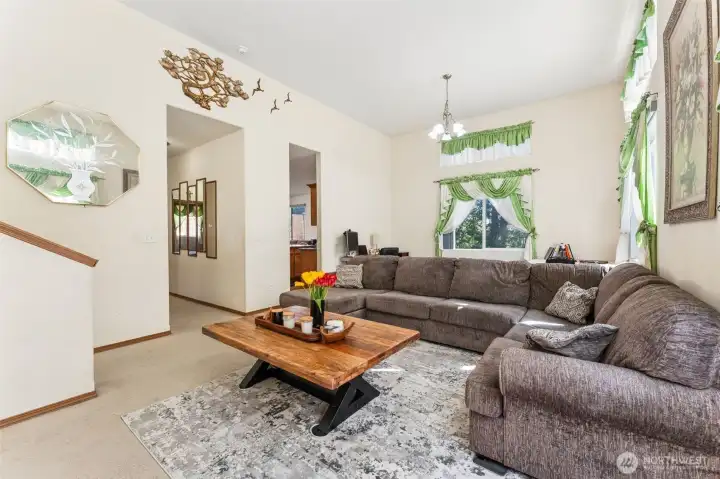 right living room offering a comfortable and inviting gathering space.