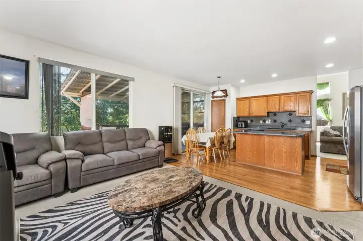 Open family room flowing into the dining nook and kitchen for easy connection.