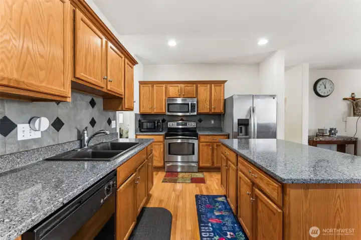Kitchen offers abundant counter space, providing plenty of room for cooking and meal preparation.