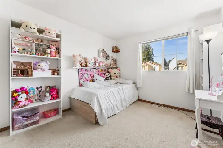 Bedroom filled with abundant natural light, creating a bright and inviting space.
