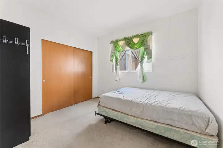 Versatile main-level bedroom or flex space ideal for a variety of uses.