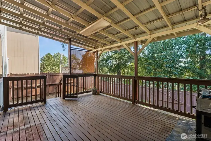 Spacious covered deck perfect for year-round outdoor living and entertaining.
