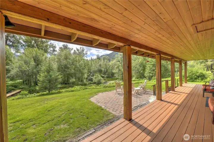 Covered deck and patio with fire pit.