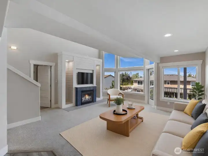 Virtually staged living room with view of the cozy fireplace and views of Puget sound Virtually staged living room with view of the cozy fireplace and views of Puget sound