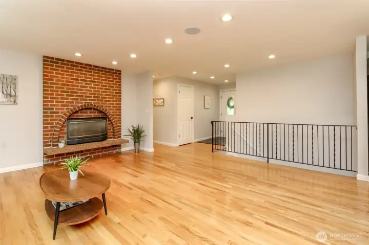 A huge living room with timeless hardwood floors and room to relax, gather, and entertain.
