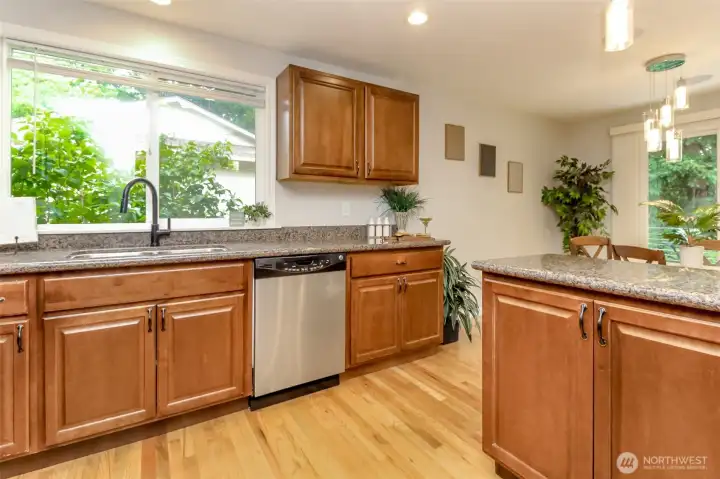 A bright kitchen with a window above the sink that brings in beautiful natural light