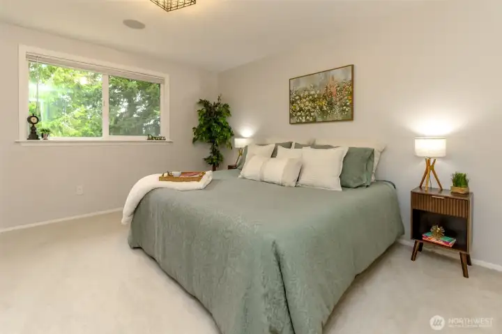 Spacious master bedroom with plenty of room to relax and unwind.