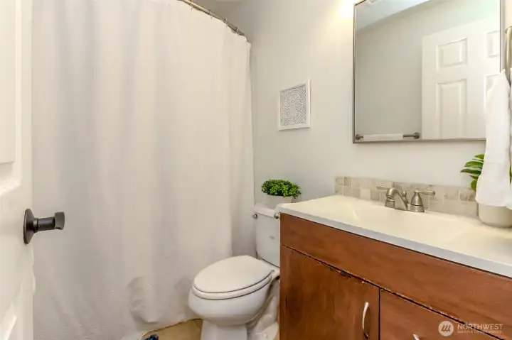 This main floor bathroom makes hosting guests easy and comfortable.