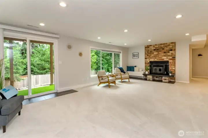 The lower level adds even more living space with a huge family room and fireplace insert - perfect for gathering, relaxing, and entertaining.