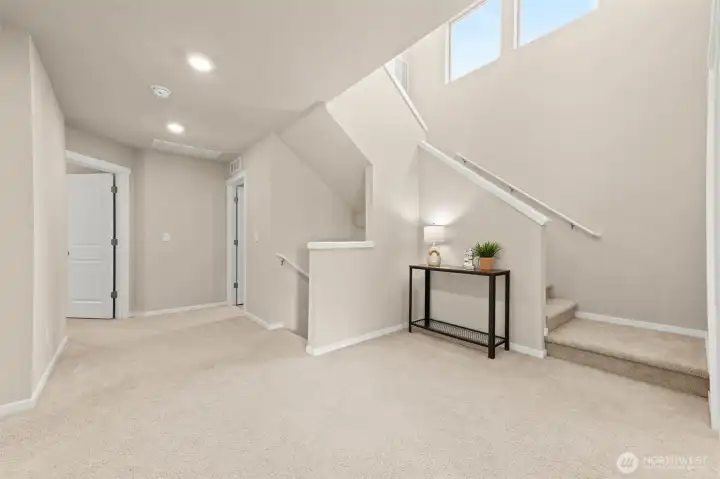 spacious second level hallway that leads to the third floor rec room. spacious second level hallway that leads to the third floor rec room.