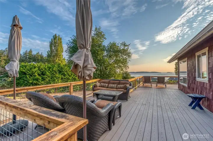 Expansive deck, rebuilt in 2017, with space for outdoor dining, entertaining, and taking in the water and island views. Expansive deck, rebuilt in 2017, with space for outdoor dining, entertaining, and taking in the water and island views.