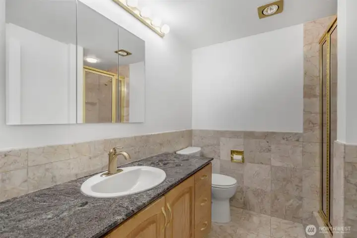Hallway bathroom with shower and lots of storage Hallway bathroom with shower and lots of storage