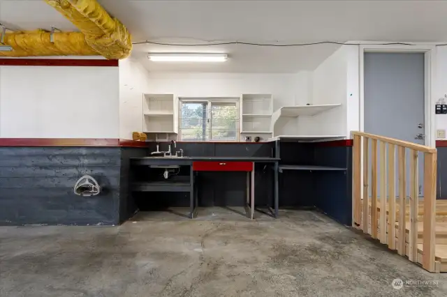 Large 2 car garage with plenty of workspace & deep sink