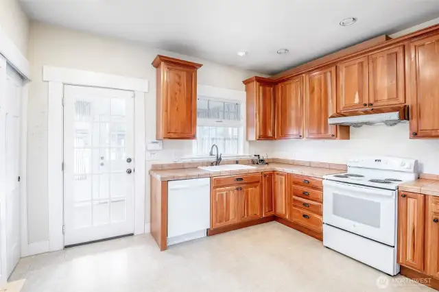 Kitchen with French style door into utility and side mud room