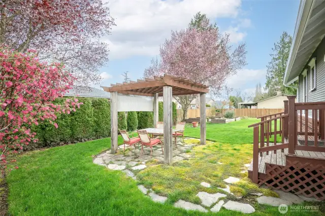 Fully fenced rear and side yard, mature landscaping complete with cobble stone walkways and gazebo.