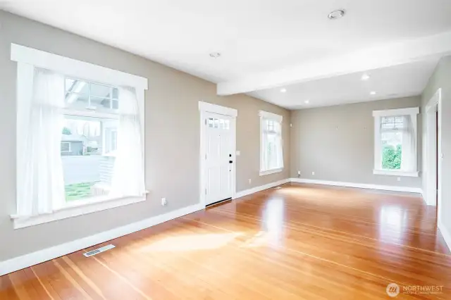 South facing home allows so much natural light in this spacious living room with gleaming natural fir hardwood floors