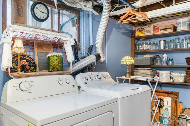 Downstairs laundry room with plenty of storage space.