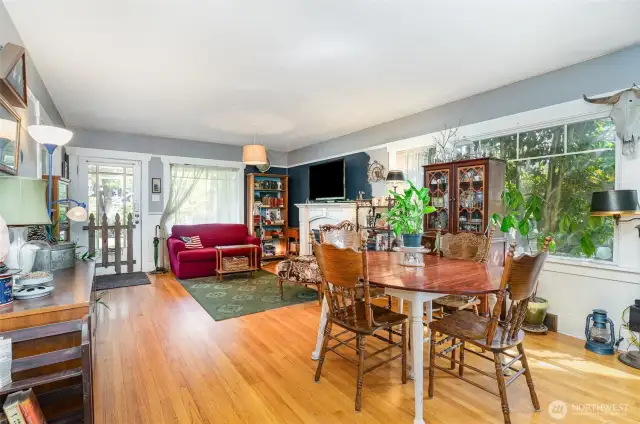 The living and dining rooms seamlessly flow together, creating a welcoming and open space perfect for entertaining or everyday living.