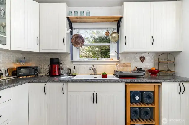 Window above the sink bring in tons of natural light.